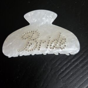 bebe Pearlized White Rhinestone Script Hair Claw